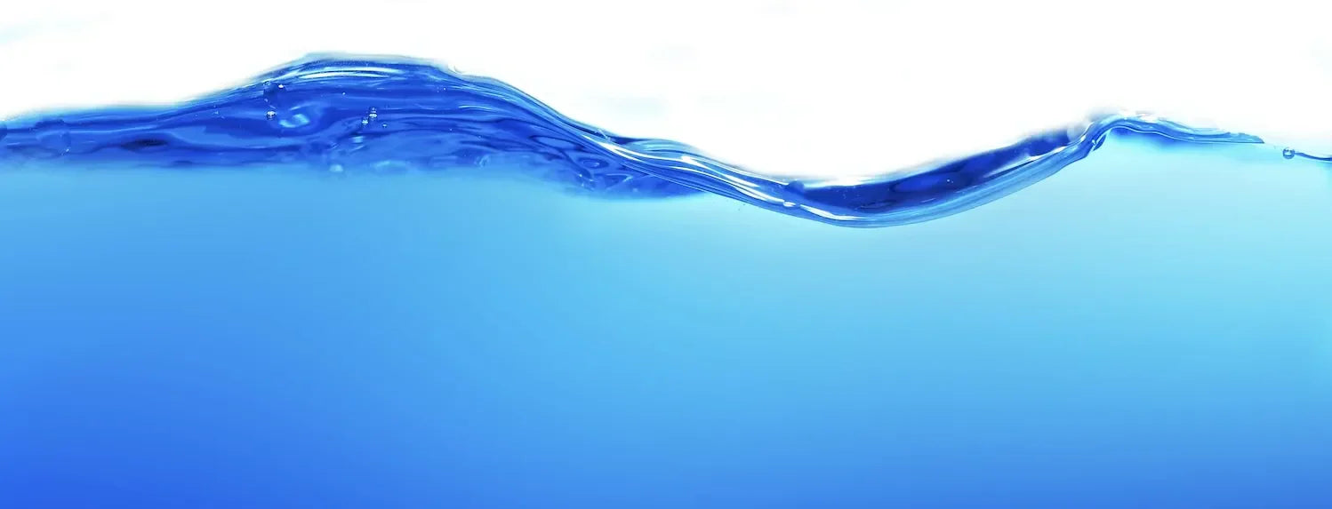 Blue water wave surface representing hydroponic nutrient solution, highlighting reservoir temperature control for optimal plant growth.