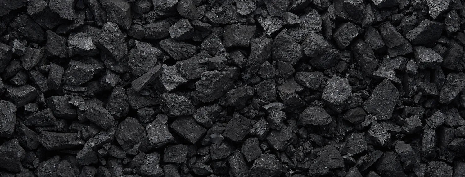Close-up of activated carbon charcoal chunks used in hydroponic grow rooms for odour control, air filtration and carbon filter systems.