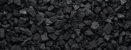 Close-up of activated carbon charcoal chunks used in hydroponic grow rooms for odour control, air filtration and carbon filter systems.