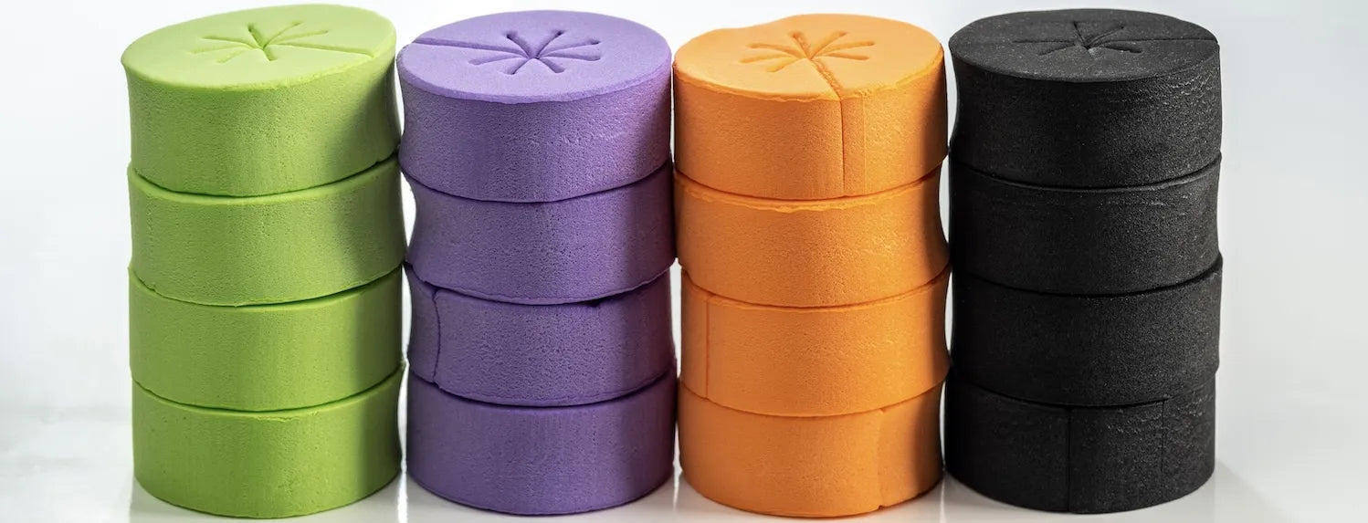 Coloured foam cloning collars for aeroponic systems, used for plant cuttings propagation in hydroponic cloning and seedling development.