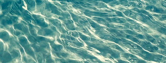 Close-up of rippling water surface, illustrating hydroponic nutrient solution temperature control and water movement for healthy plant growth