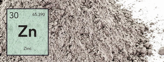 Close-up of zinc nutrient powder with Zn element symbol overlay, essential hydroponic micronutrient for enzyme function, plant growth regulation and improved yields in Australian systems