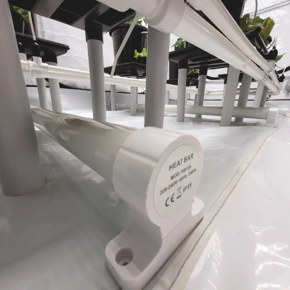 Close-up of IP55 electric grow room heat bar mounted under plant trays for efficient indoor heating
