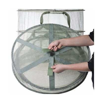 GEOPOT flower drying rack folded closed, green mesh collapsible design with strap closure for easy storage and transport.