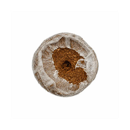 Top view of JIFFY 7C coir pellet showing peat-free coir and centre seed hole inside fine mesh netting